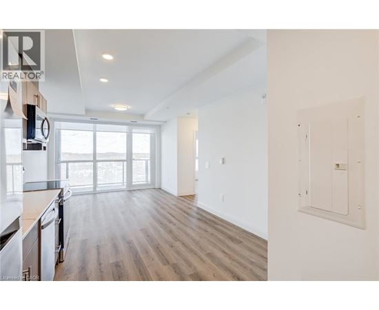 A realtor's image of a kitchen and living room.