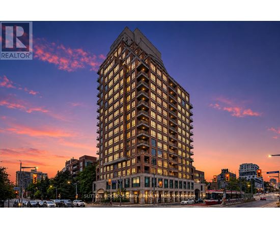 A tall building with many windows is the main focus of the image.