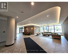 A spacious waiting area with a curved ceiling and multiple seating options.