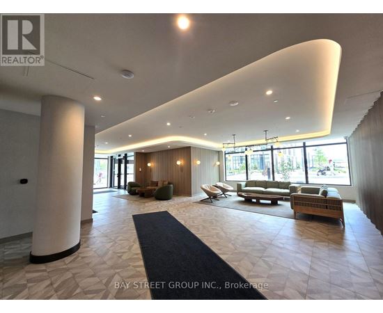 A spacious waiting area with a curved ceiling and multiple seating options.