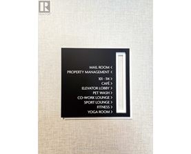 A sign with black background and white text lists the amenities of a hotel.