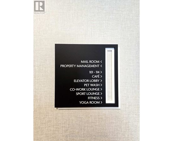 A sign with black background and white text lists the amenities of a hotel.
