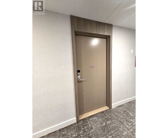 A brown door with the number 1507 on it.
