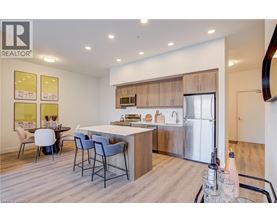 A modern kitchen with a dining table and chairs.