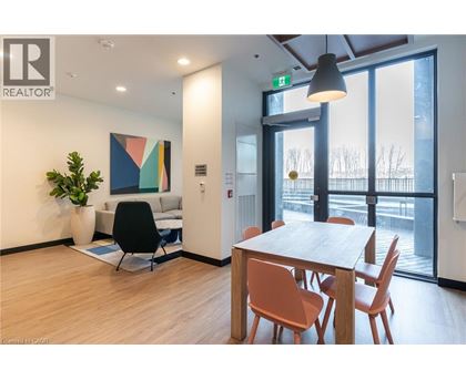 A modern office space with a wooden table and chairs.