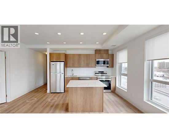 A modern kitchen with wooden cabinets and a white island.