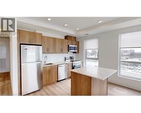 A kitchen with wooden cabinets and a white refrigerator.