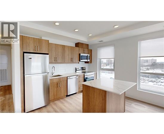 A kitchen with wooden cabinets and a white refrigerator.