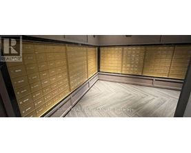 A brokerage office with a wall of mailboxes.