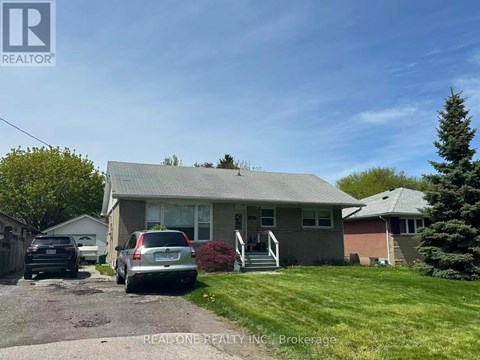 A house with a car parked in front of it.