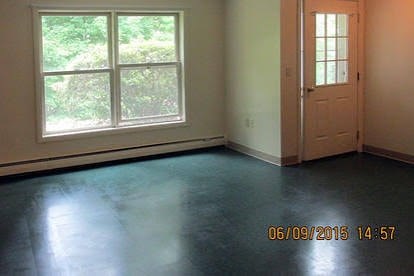 A room with a door and a window.