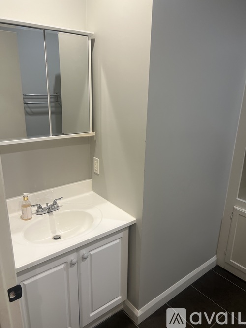 A bathroom sink with a mirror above it.
