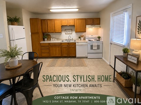 A kitchen with a table and chairs in front of it.