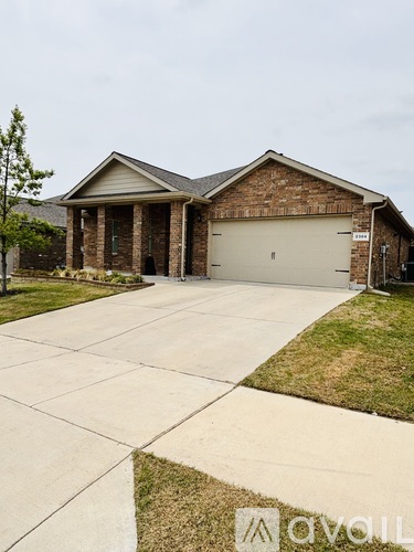 A house with a driveway in front of it.