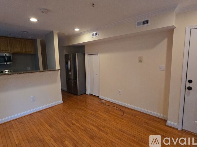 A room with wooden floors and a white door.