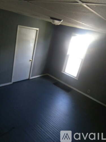 A room with a door and a window.