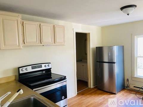 A kitchen with a stove, oven, and refrigerator.