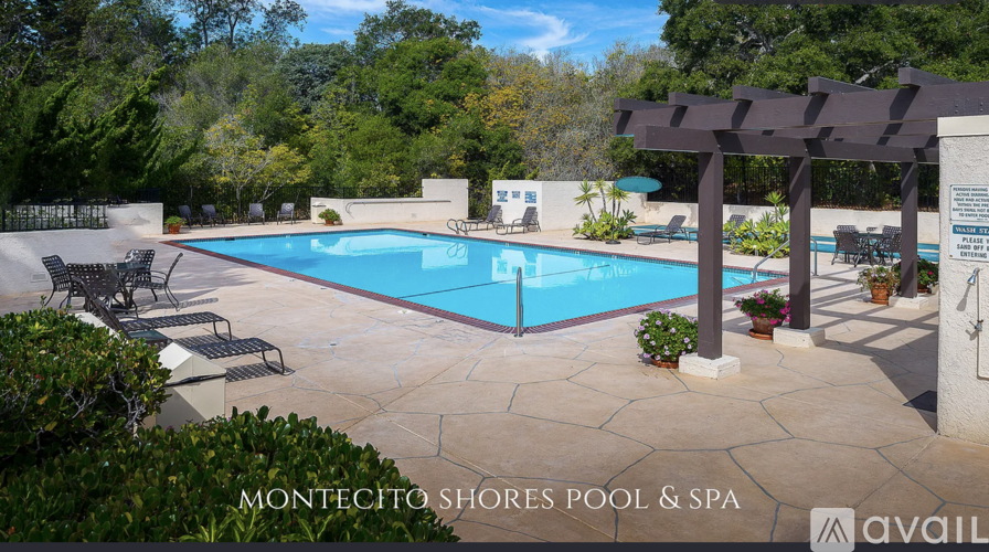 A pool and spa area with a pergola and lounge chairs.