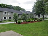 A grassy area in front of a building.