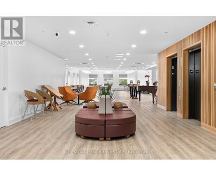 A modern office space with wooden floors and furniture.