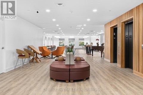A modern office space with wooden floors and furniture.