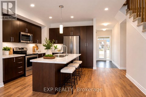 A modern kitchen with dark wood cabinets and a white island.