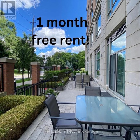 A balcony with a table and chairs is advertised for a free one month rental.