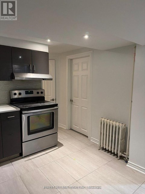 A kitchen with a stove top oven and a microwave.