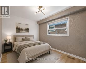 A room with a window showing a brick building outside.
