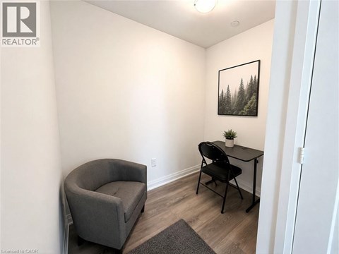 A small room with a chair and a table.