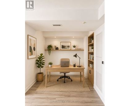 A home office with a desk, chair, and a laptop.