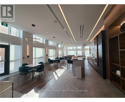A spacious office with a long table and chairs.