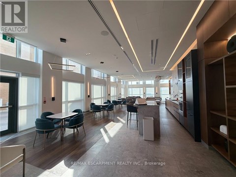 A spacious office with a long table and chairs.