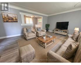 A living room with a couch, chair, and coffee table.