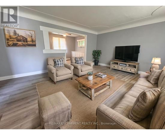 A living room with a couch, chair, and coffee table.