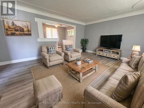 A living room with a couch, chair, and coffee table.