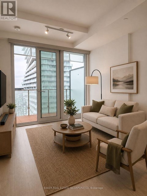 A living room with a couch, chair, and a table with a plant on it.