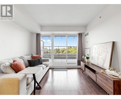 A spacious kitchen with stainless steel appliances and a refrigerator with a water dispenser.
