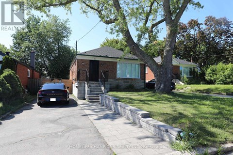 A house with a car parked in front of it.