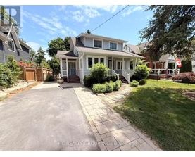 A house with a driveway in front of it.