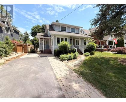 A house with a driveway in front of it.