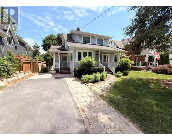 A house with a driveway in front of it.
