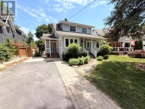 A house with a driveway in front of it.