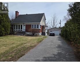 A house with a driveway in front of it.
