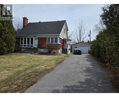 A house with a driveway in front of it.