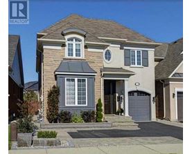 A two-story house with a garage is for sale.