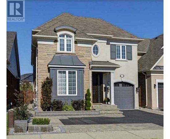 A two-story house with a garage is for sale.
