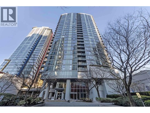 A modern glass building with a sign that says REALTOR.