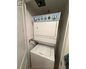 A white washer and dryer in a small laundry room.