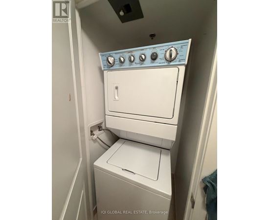 A white washer and dryer in a small laundry room.